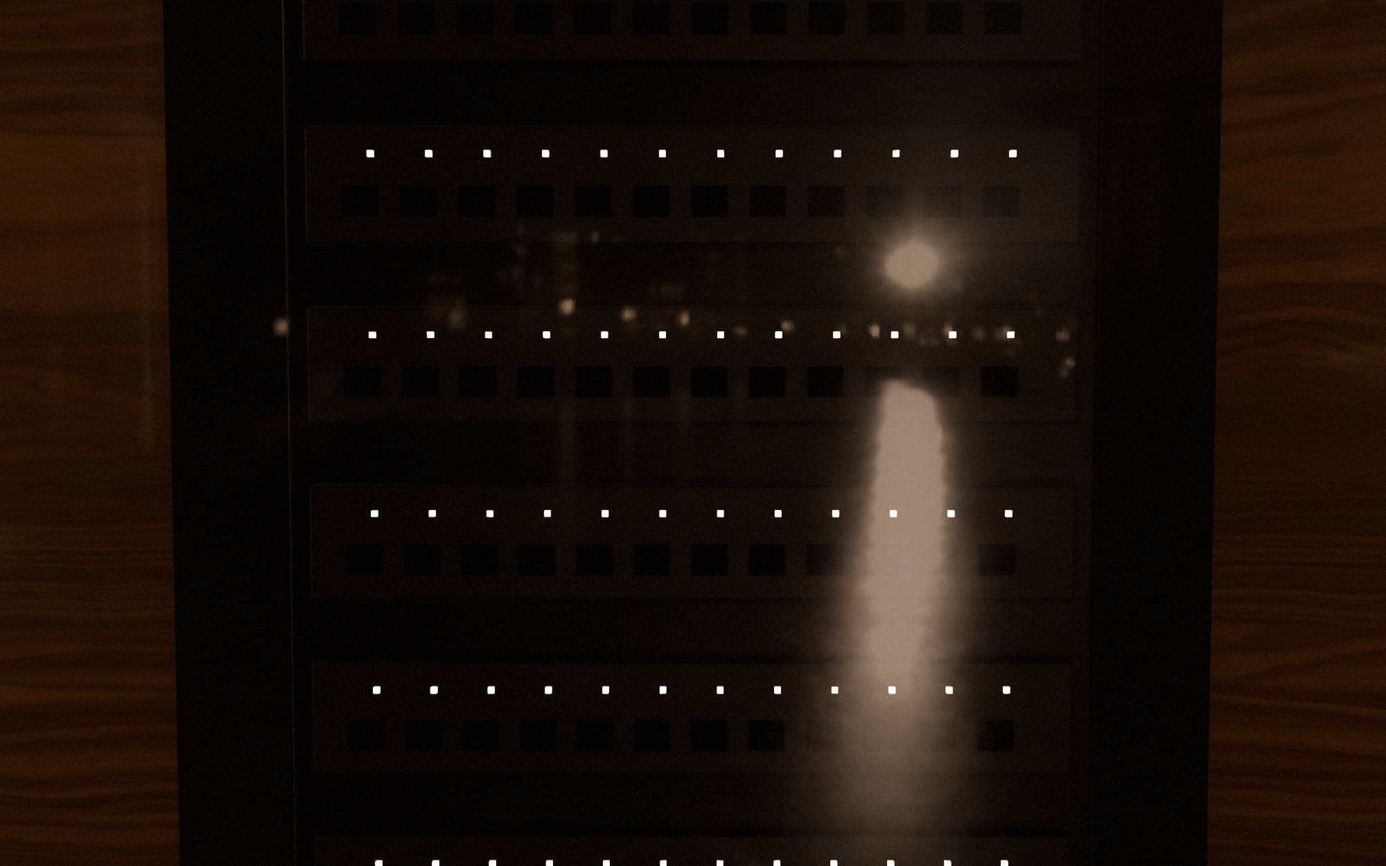 Visualisation: a network rack behind glass, with rows of small status lights.